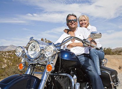 Content Hub_Explore_Motorcycle Rides-boomer man woman in desert