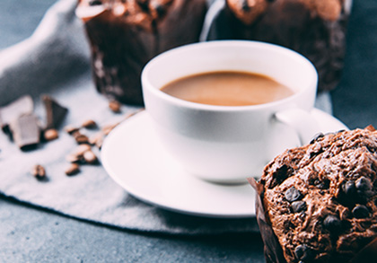 Coffee cup and muffin